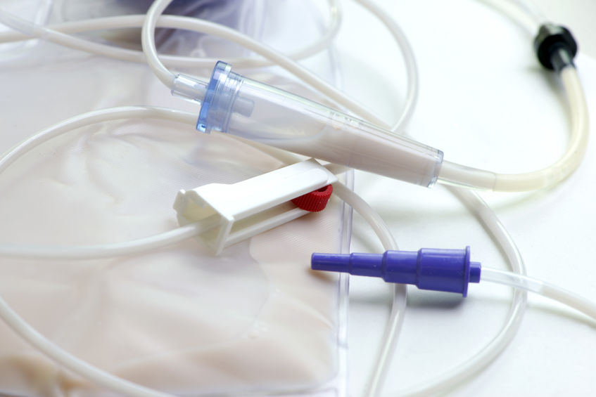 Close-up view of enteral feeding bag with flow adjuster.